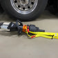 Hydraulic rescue tool with yellow strap for extrication tool carrying on truck wheel