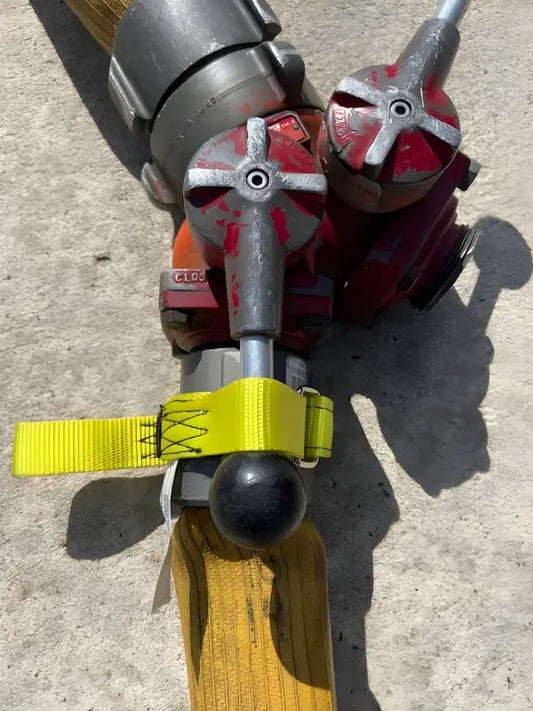 Ice climbing tool with red picks and yellow strap - FFGWS for interior firefighters