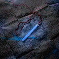 Illuminated blue M-Tac Glow Stick with red string, perfect for night activities