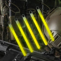 Illuminated yellow M-Tac Glow Sticks 6’’ displaying a vibrant glow in the dark