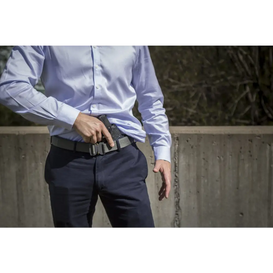 Handgun in IWB Holster Kit worn with dress pants and blue shirt, fits Beretta