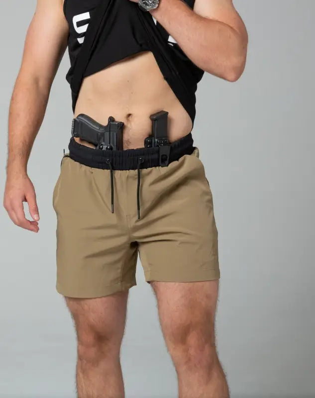 Khaki Carrier Training Shorts with dual gun holsters for tactical use and retention belt