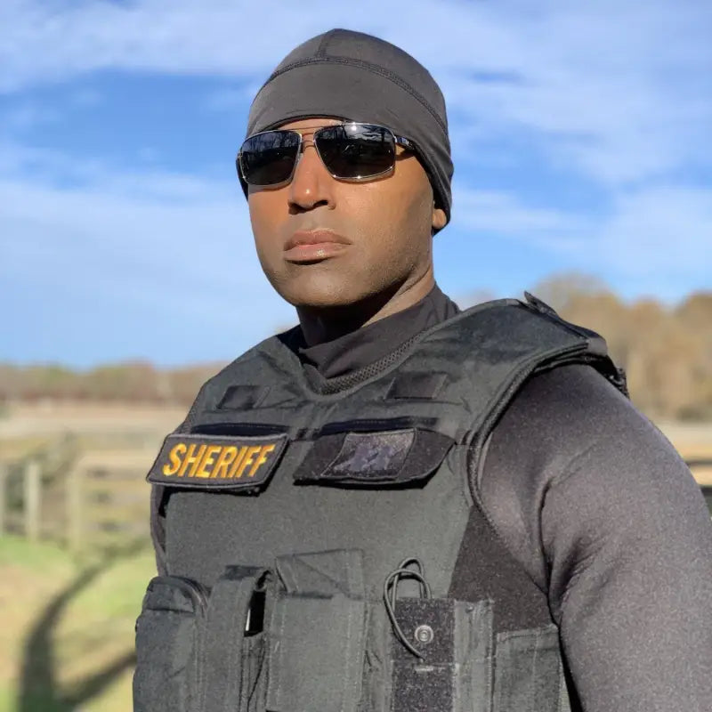 Law enforcement officer in tactical gear wearing Equinoxx Watch Cap Beanie