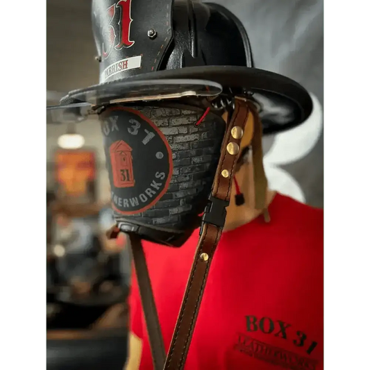 Vintage black leather firefighter helmet with number 1 and quick release leather chin strap