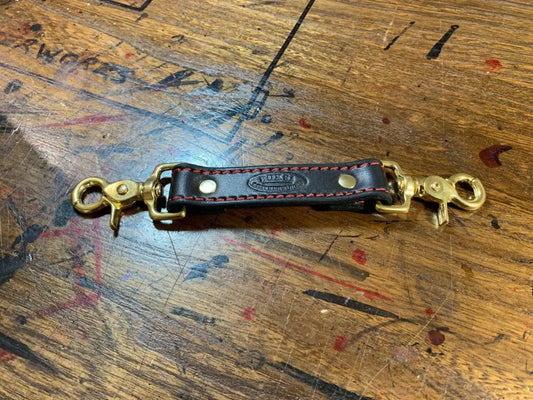 Leather anti-sway strap with brass swivel clips for secure radio strap combos