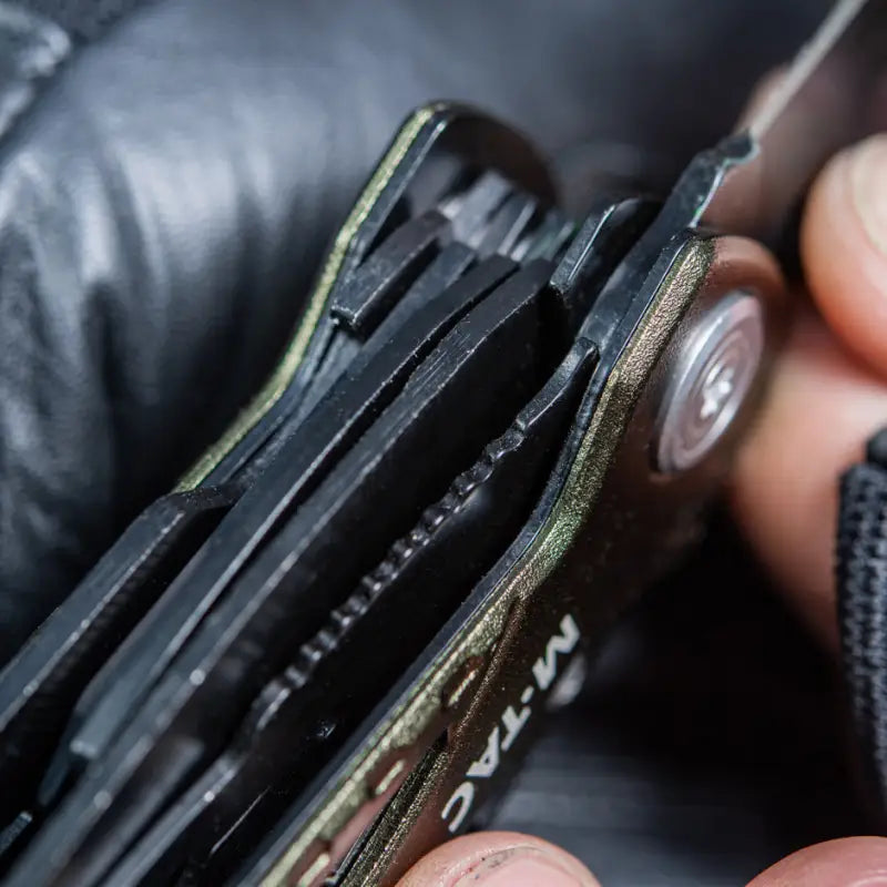 Leather wallet opened to show card slots, featuring M-Tac Universal Tool Type 2