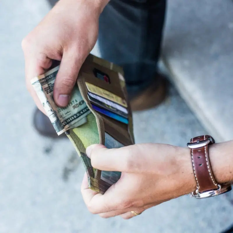 Leather wallet in Coyote Combat Leather showcasing cash and credit cards for men