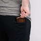 Leather wallet being pulled from Carrier Shorts - Midnight Black 11 with patented carrier retention