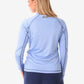 Light blue long-sleeved women’s scrub jacket with raglan seams for comfort and style