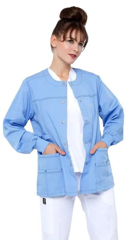 Light blue women’s snap jacket with ribbed sleeves and multiple pockets for warmth