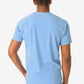 Light blue men’s double-pocket scrub top viewed from behind, showcasing comfort and style