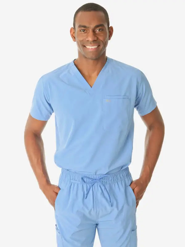 Light blue men’s double-pocket scrub uniform with v-neck top and drawstring pants