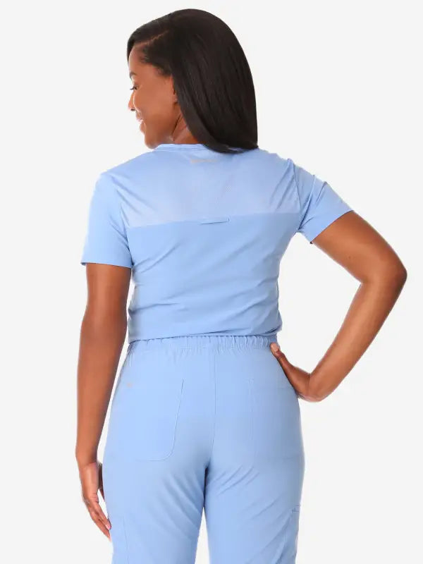 Light blue back view of Women’s Tuckable One-Pocket Scrub Top for medical professionals