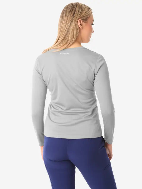 Light gray long-sleeve underscrub top displayed from the back for women