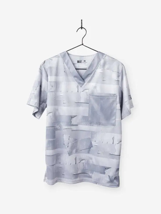 Light gray men’s duct tape scrub top with multiple pockets on a hanger