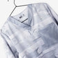 Light gray patterned t-shirt on black hanger for men’s duct tape scrub top