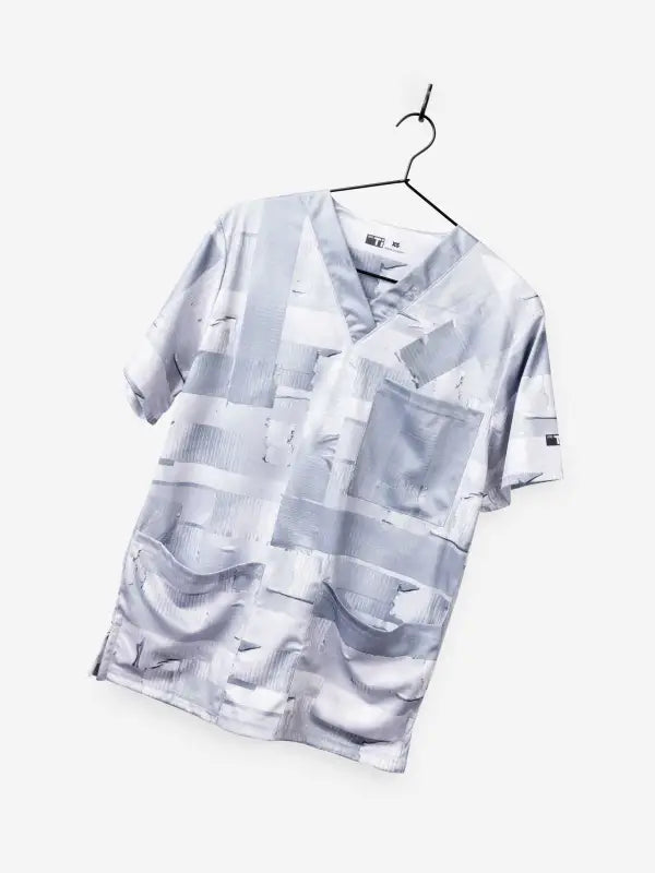 Light gray short-sleeved button-up men’s duct tape scrub top with multiple pockets