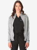 Light gray women’s scrub jacket stylishly layered over a black top for comfort