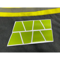 Lime green reflective geometric shapes on a white frame for reflective helmet display
