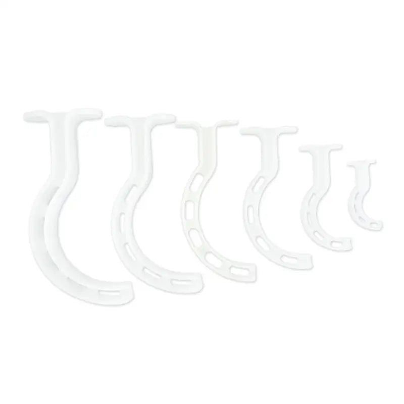 White plastic wall hooks in a row for LINE2design Berman Oral Airway Kit