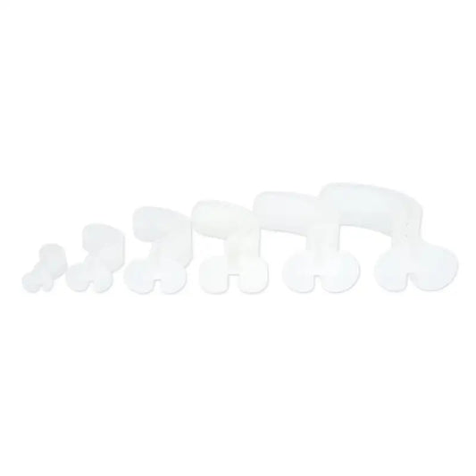 Row of white ceramic elephants in size order next to Line2design Berman Oral Airway Kit