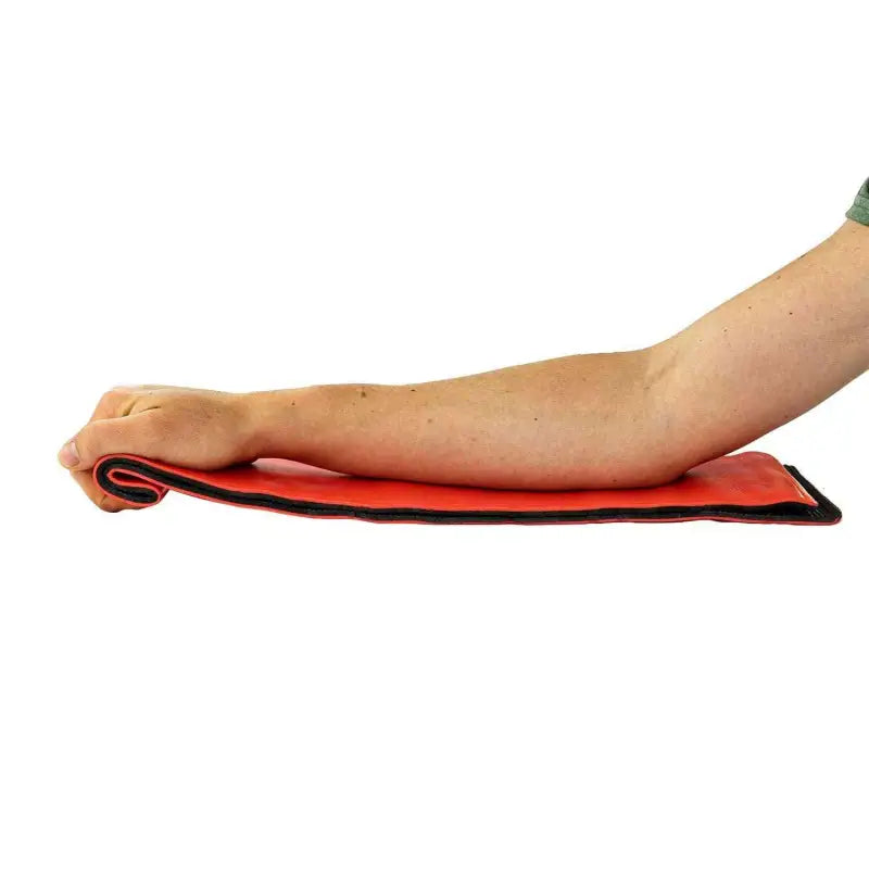 Bare arm on a red cushioned mat with LINE2design Medical EMS Flex Roll Splint