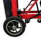 Red wheelchair wheel with black rim and white tire for LINE2design Mobile Stair Lift