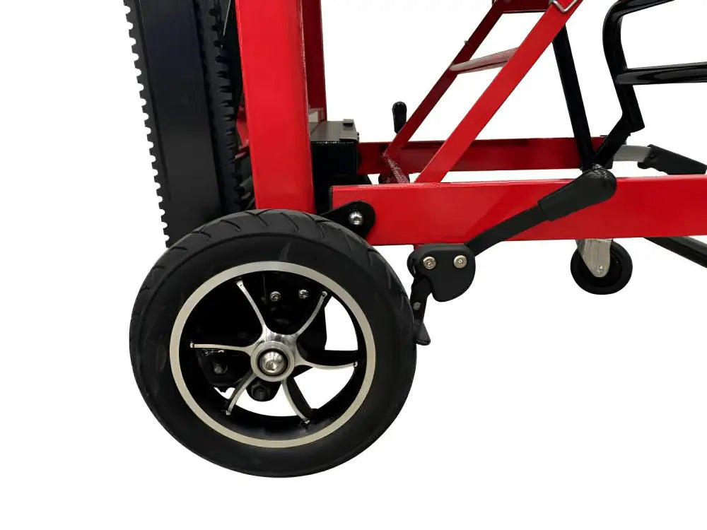 Red wheelchair wheel with black rim and white tire for LINE2design Mobile Stair Lift