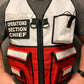 Operations Section Chief vest featuring red and white compartments and a black zipper