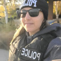 Police officer in tactical gear with Frontline Optics for first responders
