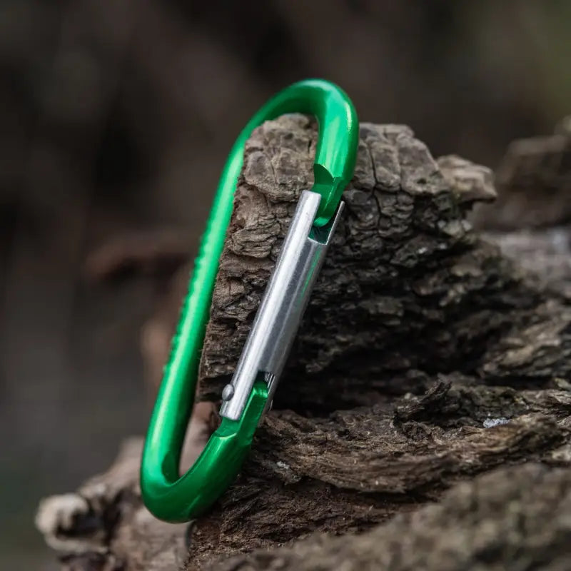 Green M-Tac carabiner with spring-loaded gate, ideal for first responders and firefighters