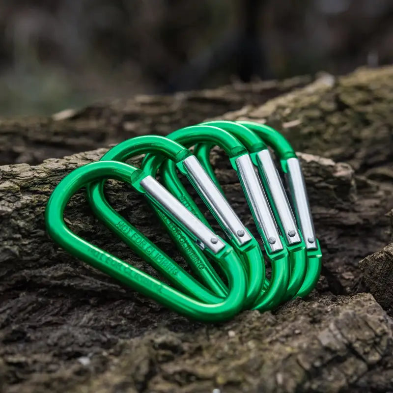 Green M-Tac Carabiners arranged in a row, ideal for first responders and firefighters