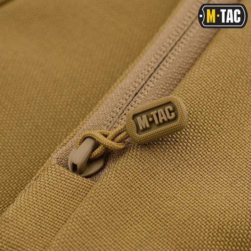 M-Tac branded zipper pull on tan fabric of Concealed Carry Sling Bag Elite Gen.IV