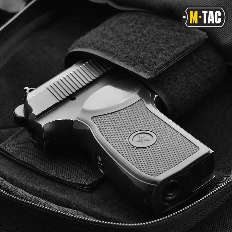 Black pistol with textured grip in M-Tac Concealed Carry Sling Bag Elite Gen.IV