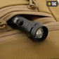 Black tactical flashlight with adjustable beam in M-Tac Concealed Carry Sling Bag Elite Gen.IV