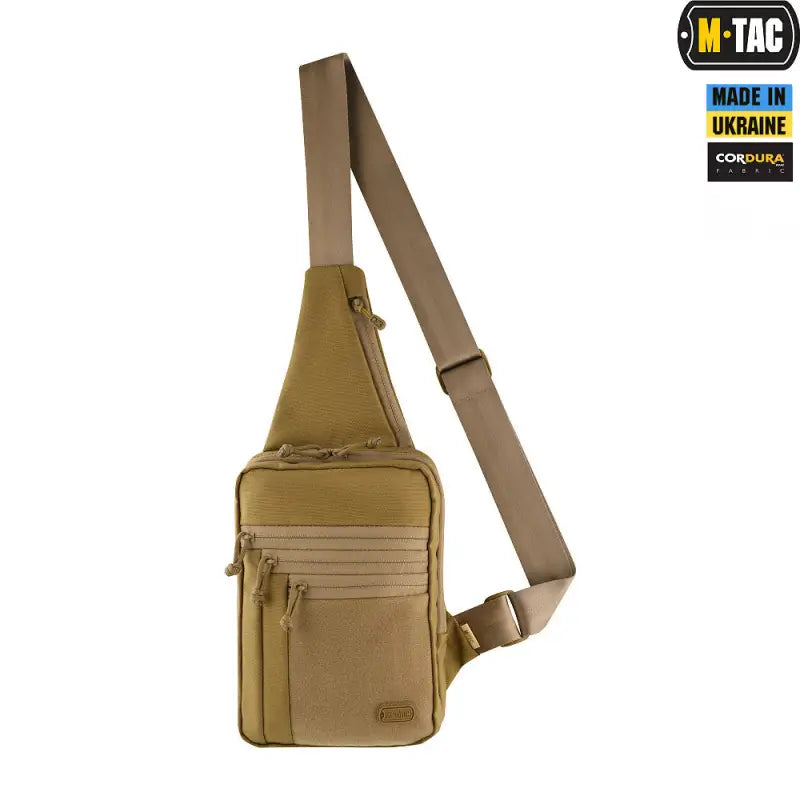 Tan M-Tac Concealed Carry Sling Bag Elite Gen.IV with adjustable strap and zippered compartments