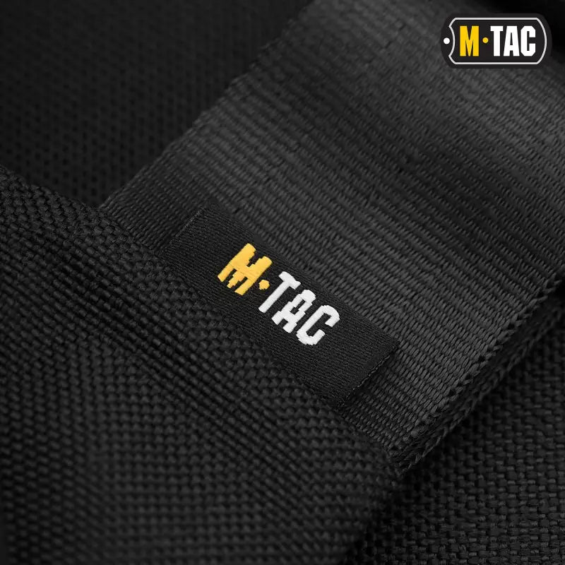 Black M-TAC Concealed Carry Sling Bag Elite Gen.IV with gold and white logo