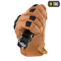 Tactical glove in coyote brown holds a black flashlight for M-Tac Gloves Assault