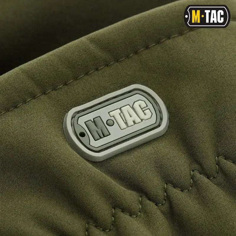 M-Tac logo patch on olive green fabric featuring stitching for M-Tac Gloves Soft Shell Thinsulate