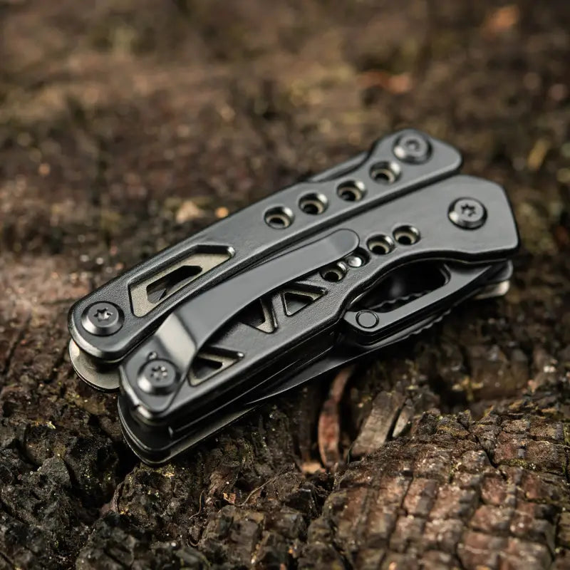 Black metallic folding pocket knife with cutout designs in M-Tac Multitool Type 6