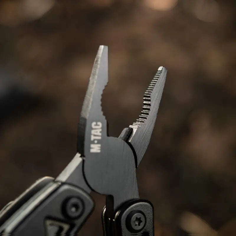 Multi-tool pliers with serrated gripping surfaces from M-Tac Multitool Type 6 Black/Olive