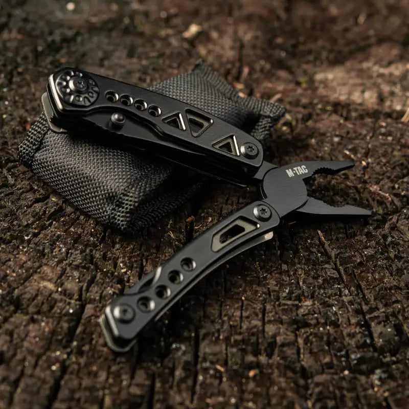 Black folding pocket knife with textured handle grips from M-Tac Multitool Type 6