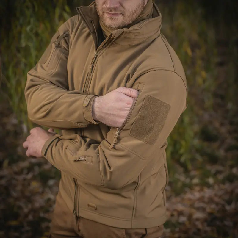 Tan M-Tac Soft Shell Jacket featuring multiple zippers and two shoulder pockets