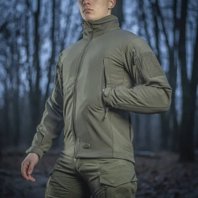 Olive green M-Tac Soft Shell Jacket with two shoulder pockets and high collar