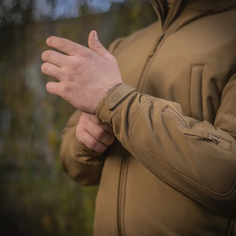 Tan M-Tac Soft Shell Jacket featuring zippered sleeve pocket and two shoulder pockets