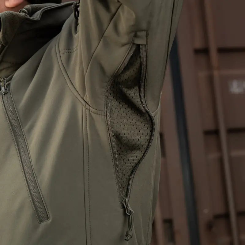 Olive green M-Tac Soft Shell Jacket with zipper details and two shoulder pockets