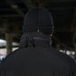 Black knit winter beanie on a person wearing M-Tac Soft Shell Jacket with two shoulder pockets