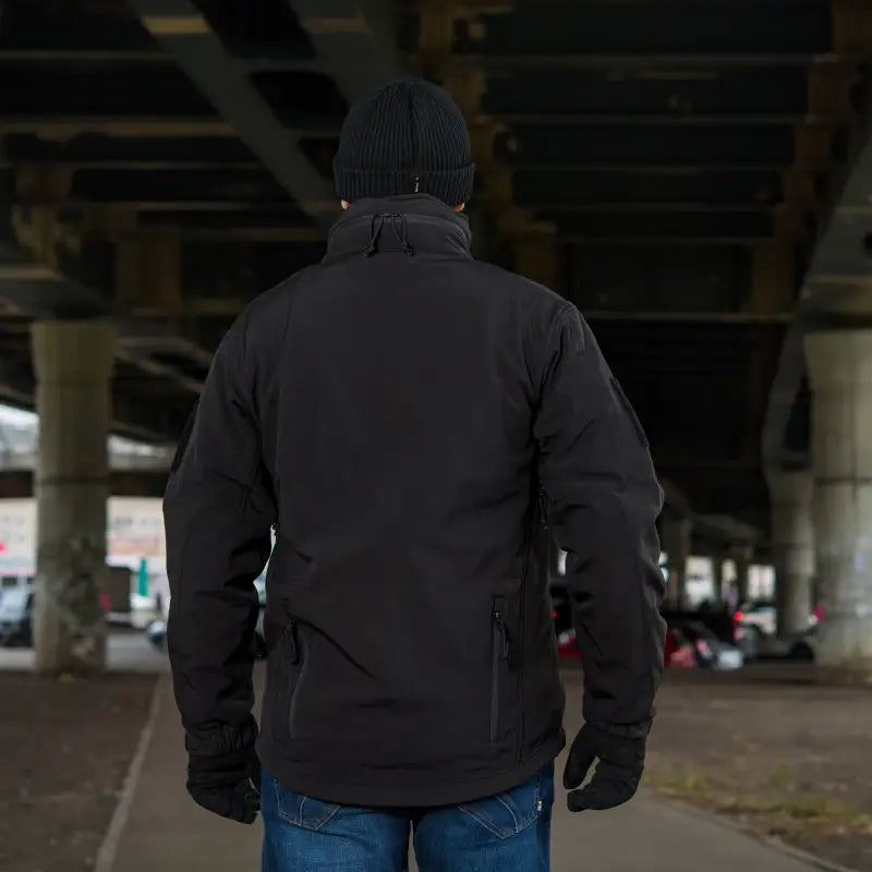 Person in M-Tac Soft Shell Jacket with Liner and blue jeans showing two shoulder pockets