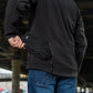 Black M-Tac Soft Shell Jacket with two side pockets styled with blue jeans