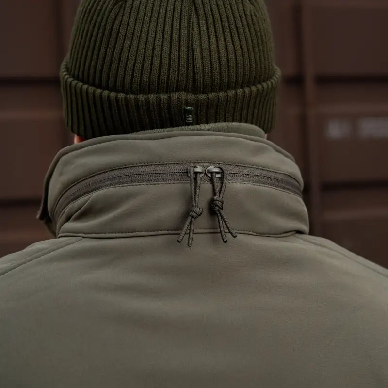 Olive green winter beanie and collar zipper detail of M-Tac Soft Shell Jacket